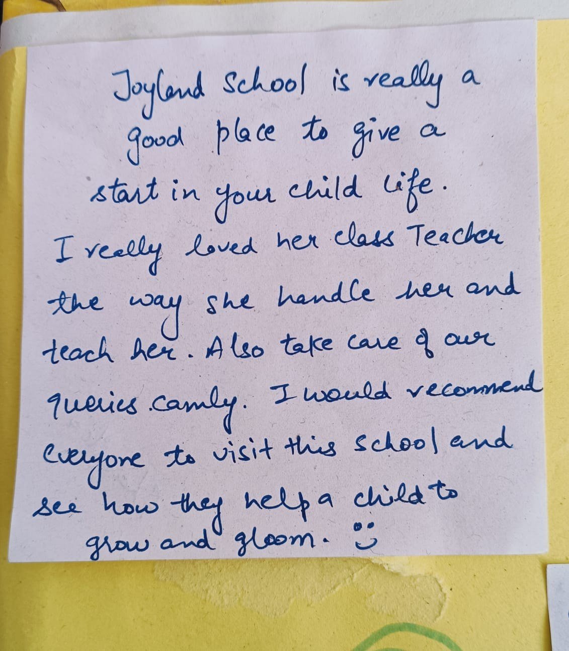 Handwritten parent note on a sticky note
